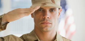 US soldier saluting flag..